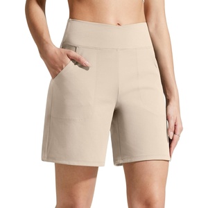 G4Free Evergoing Athletic Shorts for Women with Pockets 6″ Cross Waist | Soft Stretchy Fabric, Relaxed Fit, High Waist, Two Side Pockets, for Workout and Casual(Light Khaki)